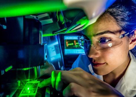Researcher performing lazer test