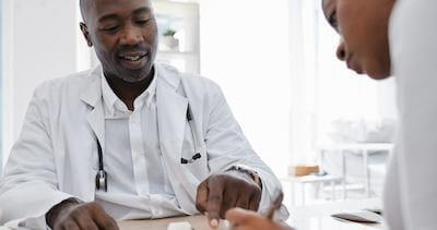 doctor and patient signing document