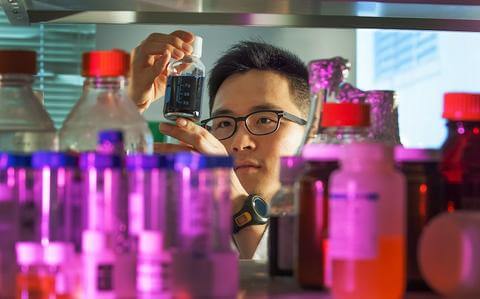 Graduate researcher with supplies