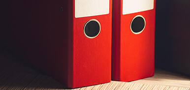 Two red file folders