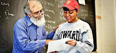 Student and professor reviewing a paper